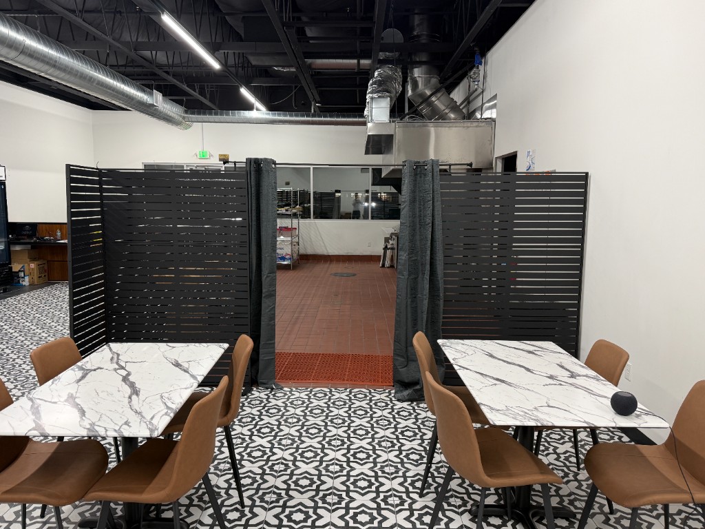 San Jose tables facing the kitchen partition